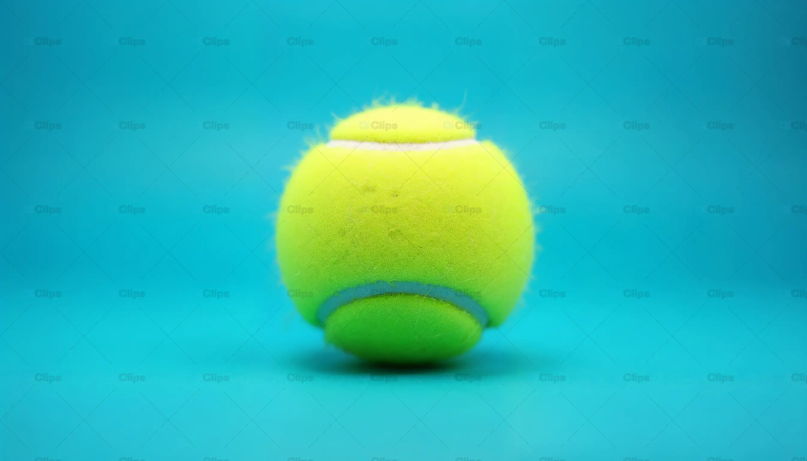 Yellow Tennis Ball on Blue Background