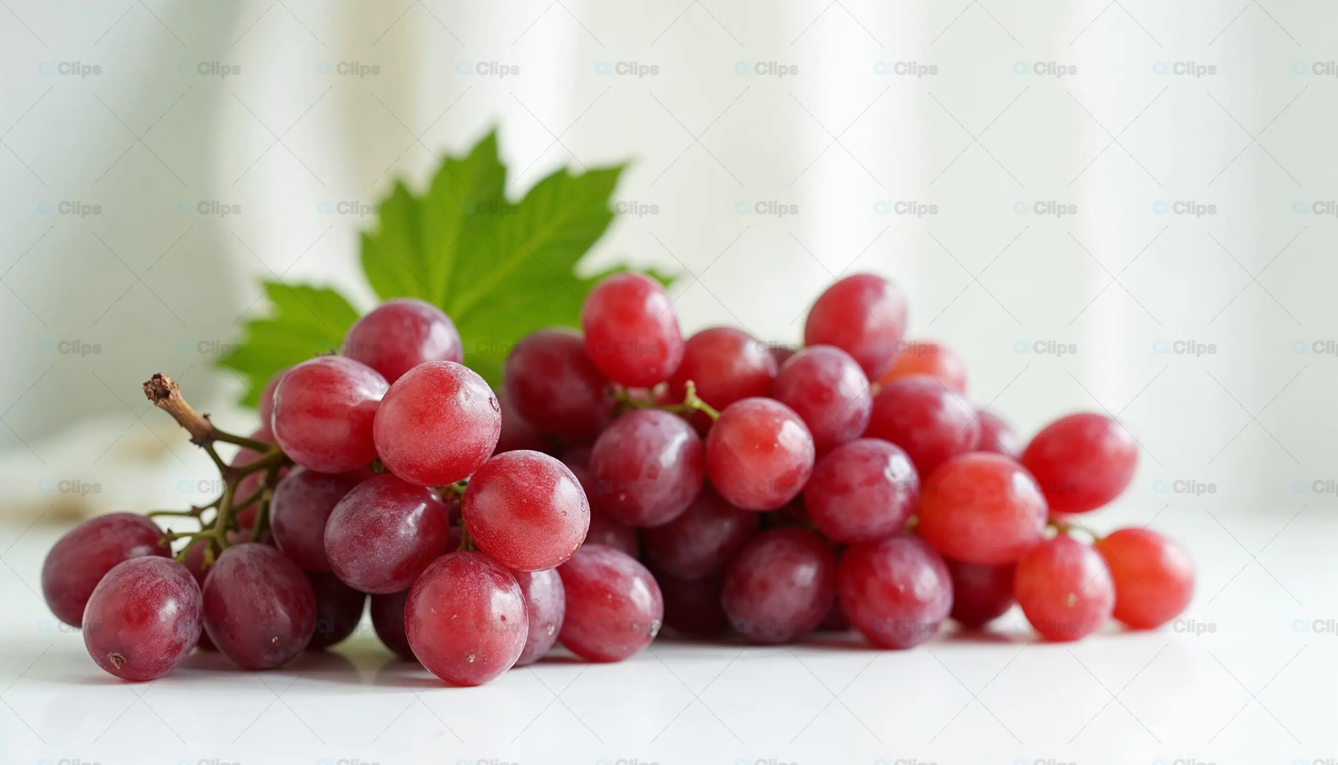 Fresh Red Grapes with Green Leaf