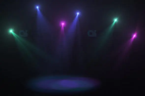 Colorful Spotlights Shining on Dark Stage with Atmospheric Glow
