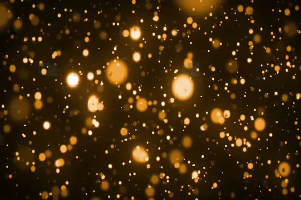 Warm Golden Bokeh Particles Floating in Dark Background | AIClips
