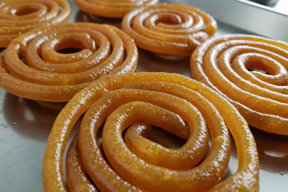 Close-Up Video of Freshly Made Indian Jalebi Sweets on a Tray