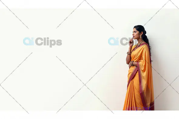 Graceful Indian Woman in Traditional Yellow Saree