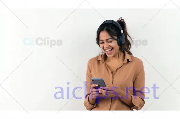 Excited Woman Listening to Music on Smartphone
