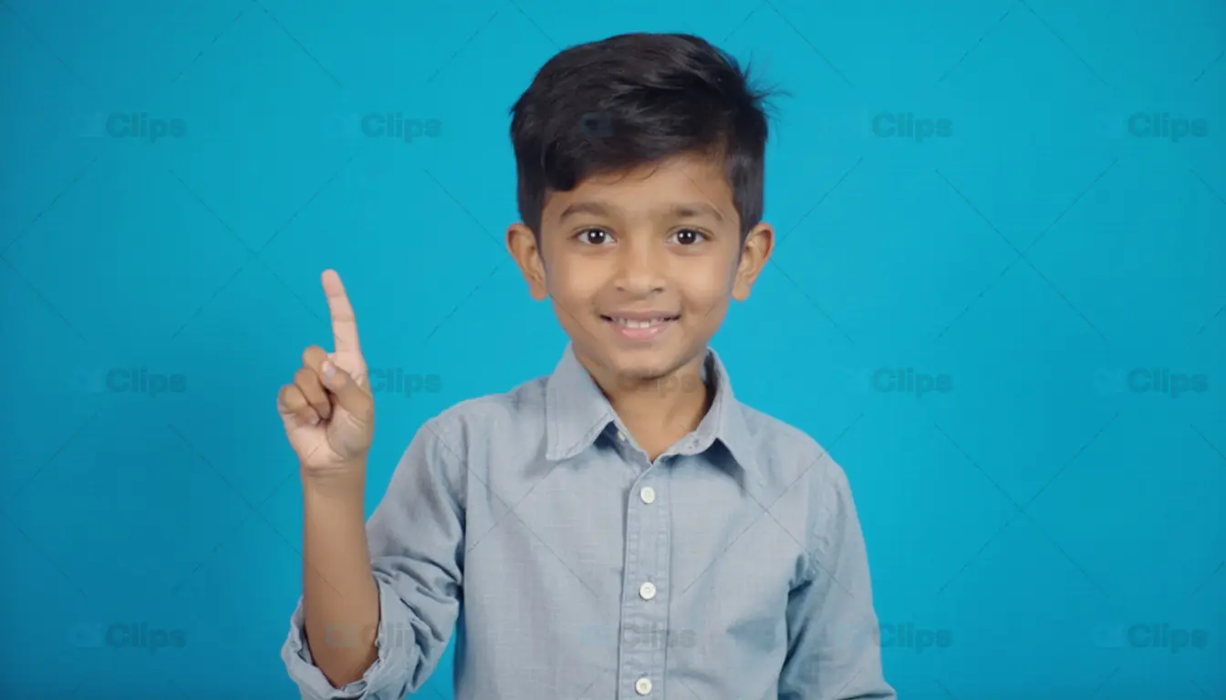Smiling Young Boy Pointing Up