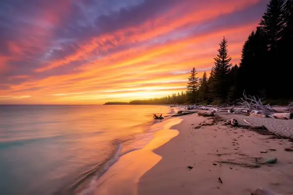 Breathtaking Coastal Sunset Illuminates Serene Beach Landscape