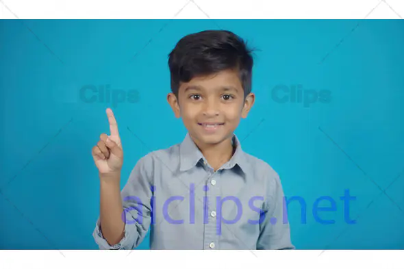 Smiling Young Boy Pointing Up