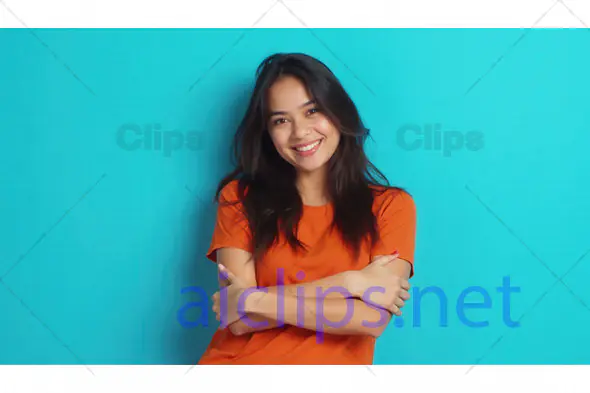 Smiling Woman in Orange T-Shirt on Blue Background