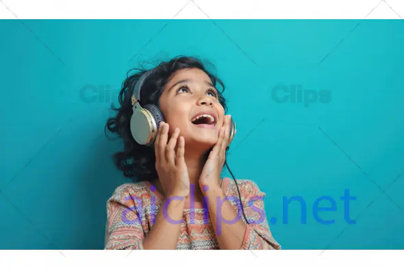 Happy Girl Listening to Music with Headphones