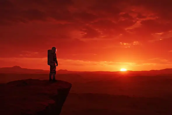 Astronaut Standing on Alien Cliff Watching Fiery Sunset Horizon