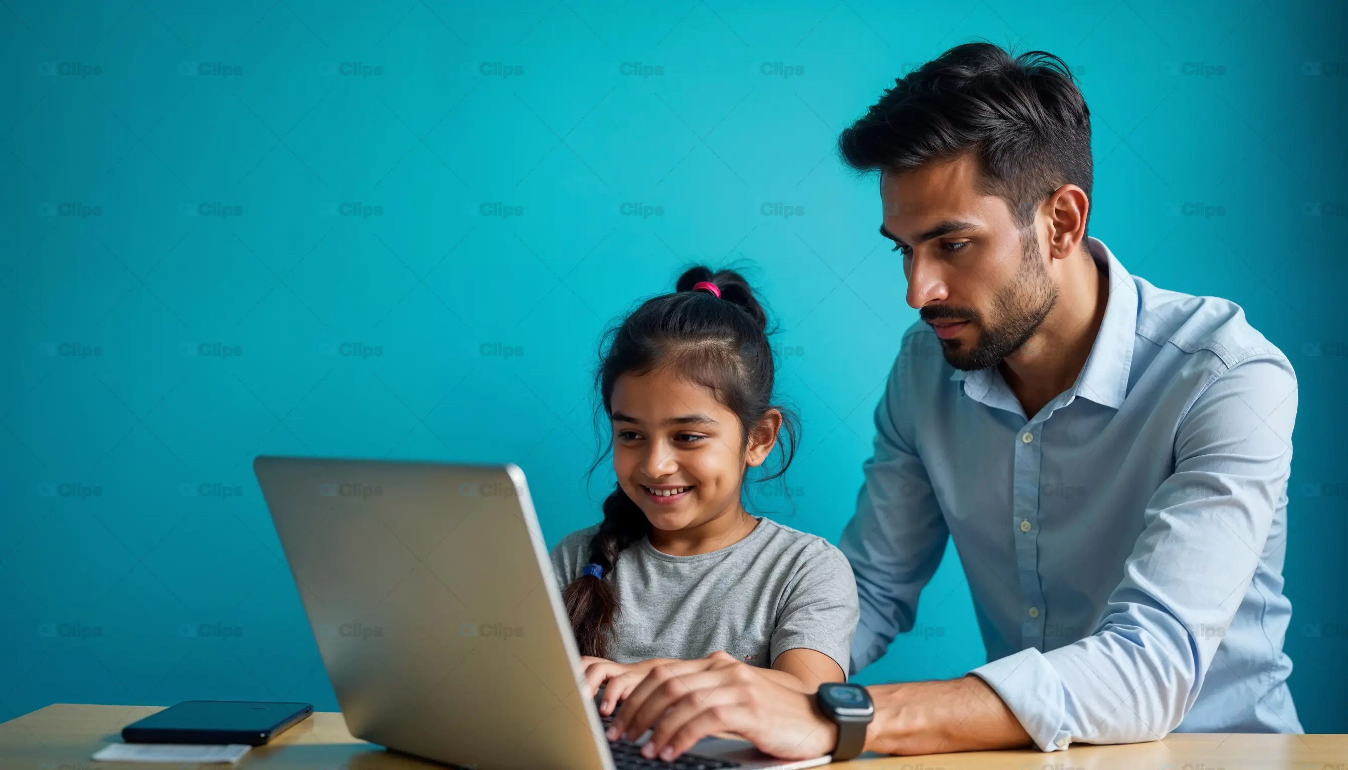 Father Teaching Daughter with Laptop