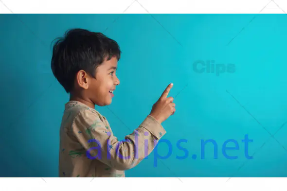 Smiling Boy Pointing Upwards