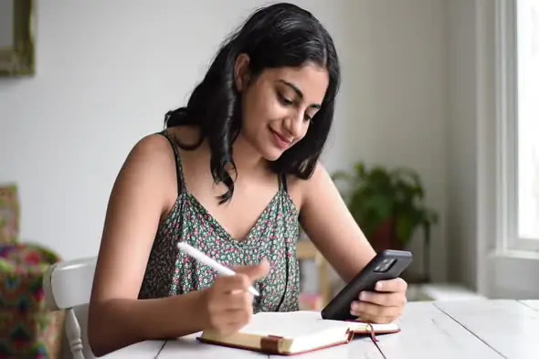 Focused Woman Multitasking at Home