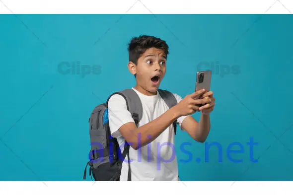 Surprised Boy Looking at Smartphone