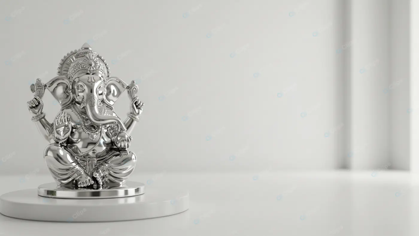 Silver Ganesha Statue on White Pedestal