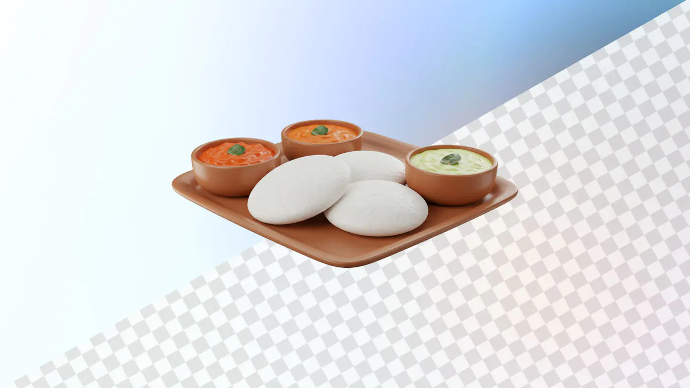 Idli with colorful chutneys on terracotta plate