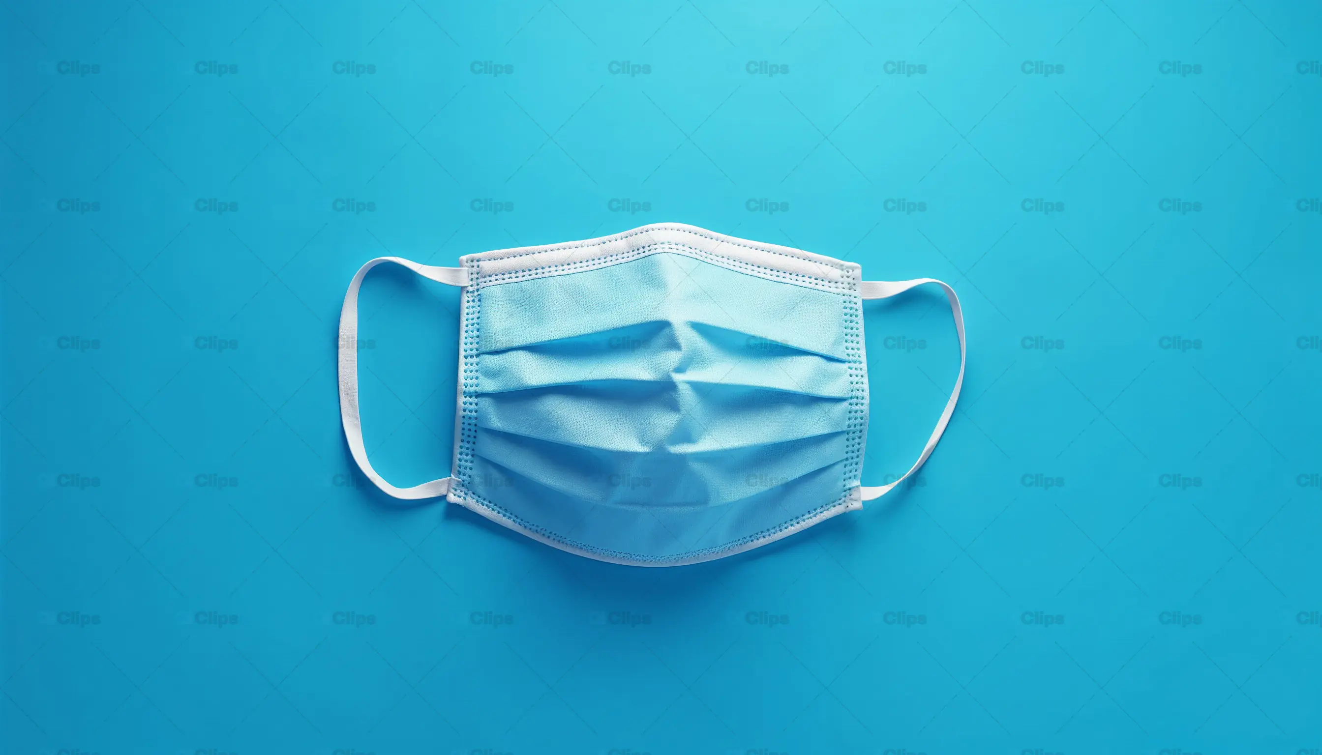 Blue Disposable Face Mask on Blue Background