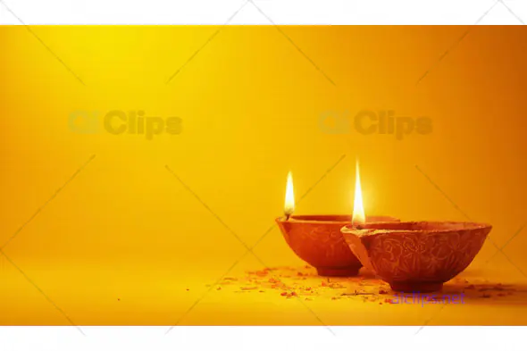 Lit Diyas on Yellow Background