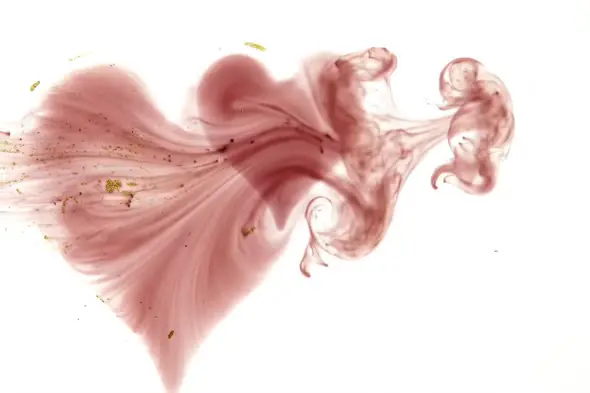 Romantic Pink Ink Heart Shape Swirl in Water on White Background