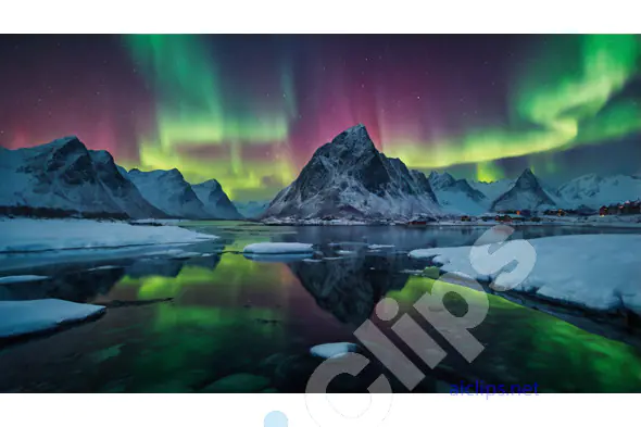 Northern Lights Over Snowy Mountain Landscape