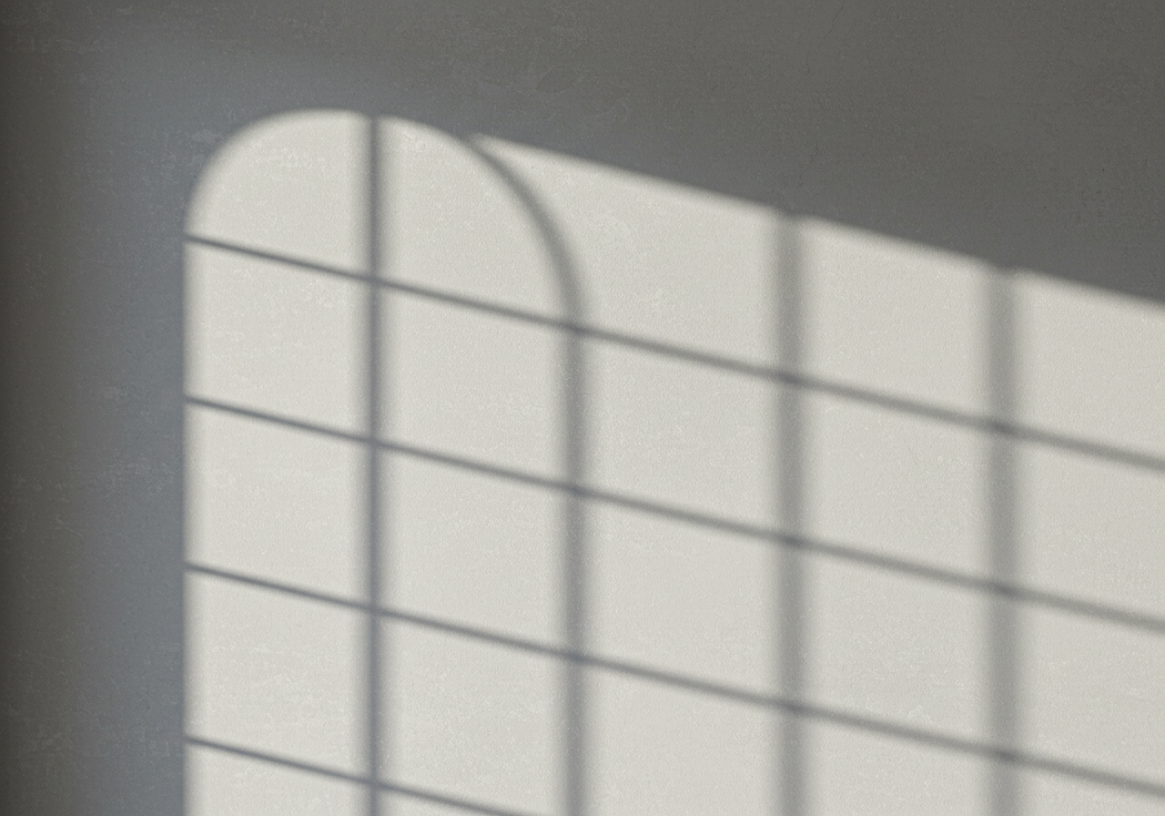Sunlit Window Grid Shadow on Wall