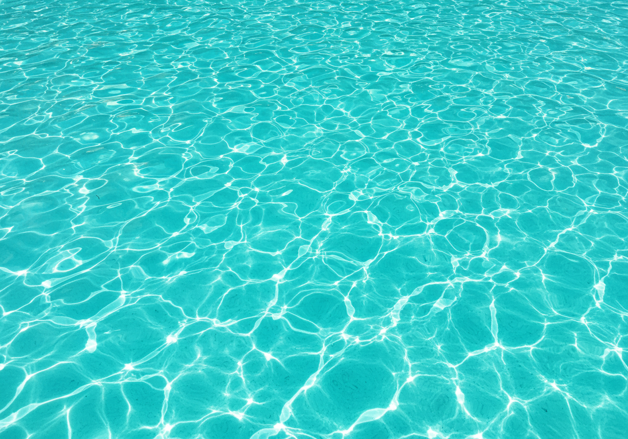 Turquoise Pool Water with Sunlit Reflections