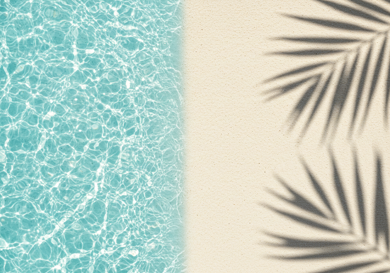 Sunny Beach with Palm Shadows and Clear Blue Water