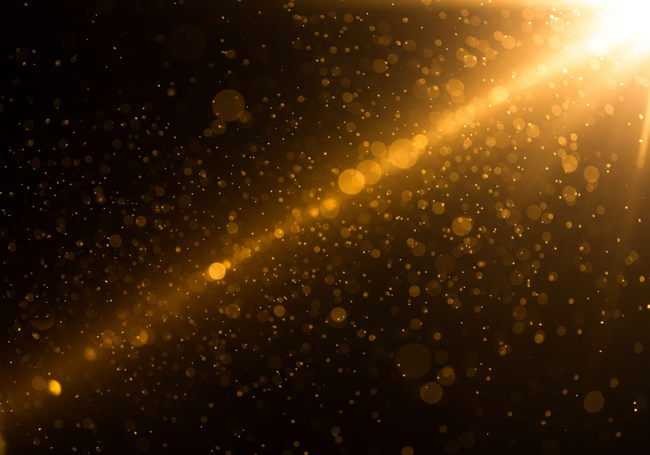 Golden Light Particles on Dark Background