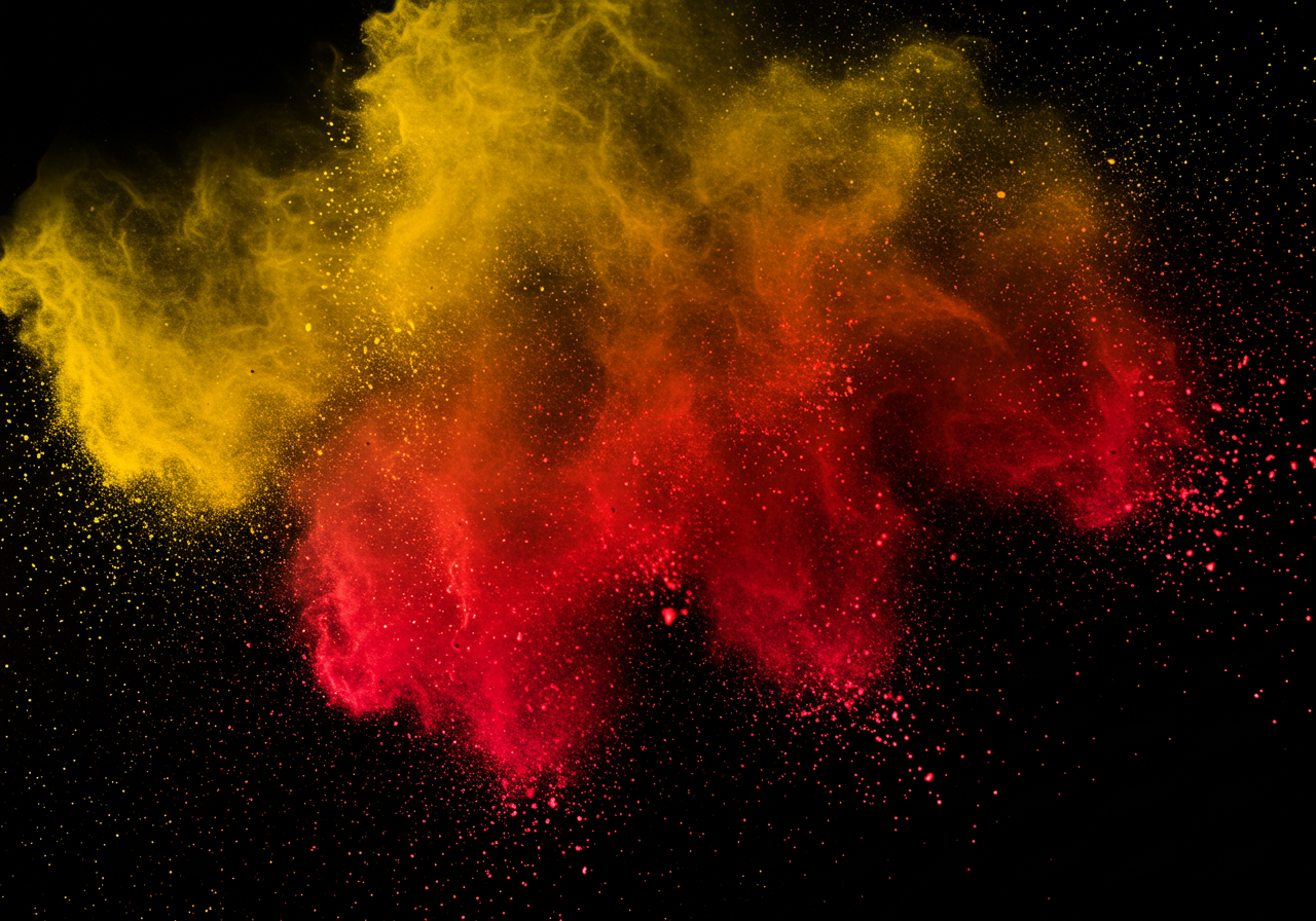 Vibrant Red and Yellow Powder Explosion on Black Background