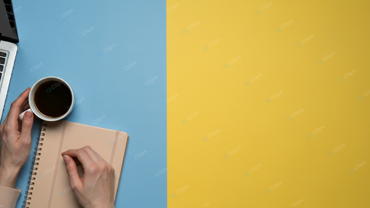 Coffee and Notebook on Colorful Desk Workspace