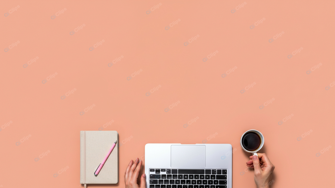 Laptop and Notebook Workspace with Coffee Cup on Peach Background