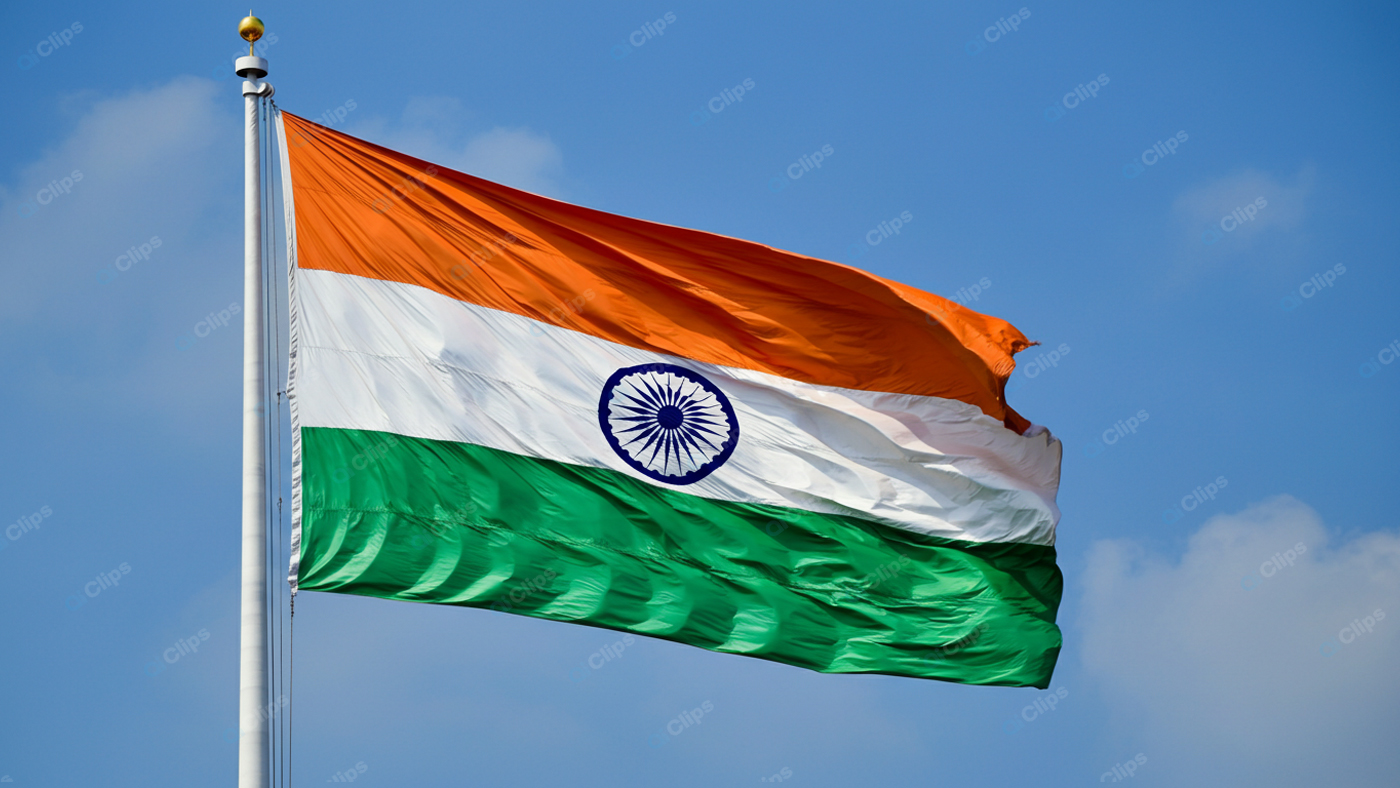 Indian National Flag Waving Against Blue Sky