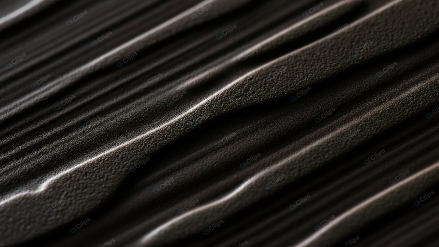 Dark Textured Surface with Wavy Pattern Close-up