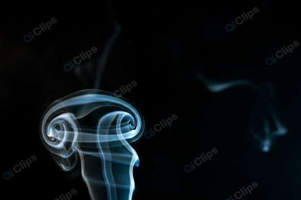 Abstract Smoke Swirls on Black Background