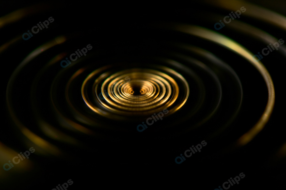 Golden Ripples on Water Surface in Darkness